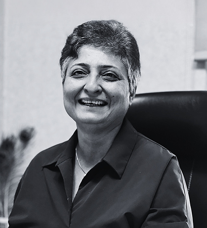 Anjali Samuel, Managing Partner at Mindfield Resources, smiling in a professional office portrait.